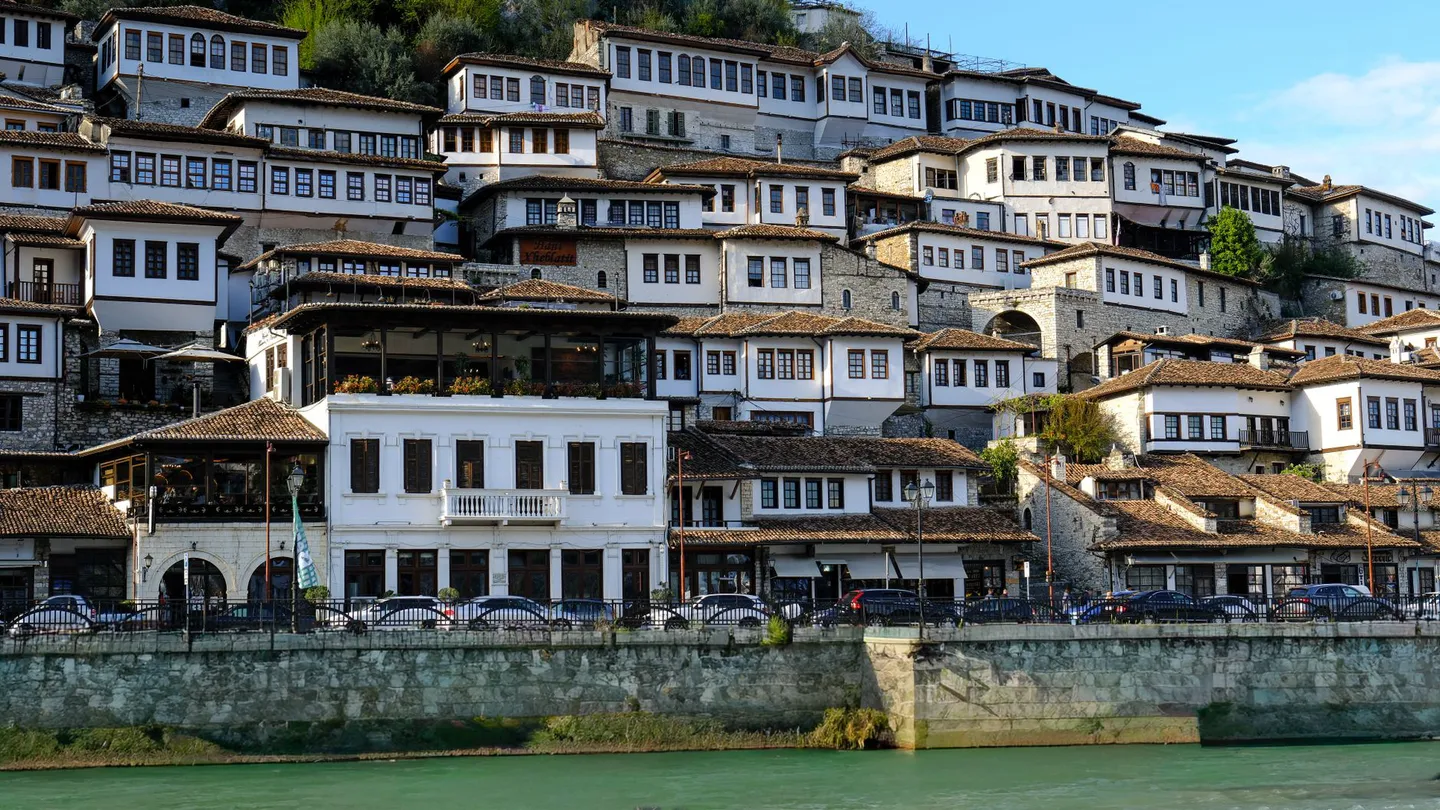 White Ottoman houses of Berat stacked above the Osum river