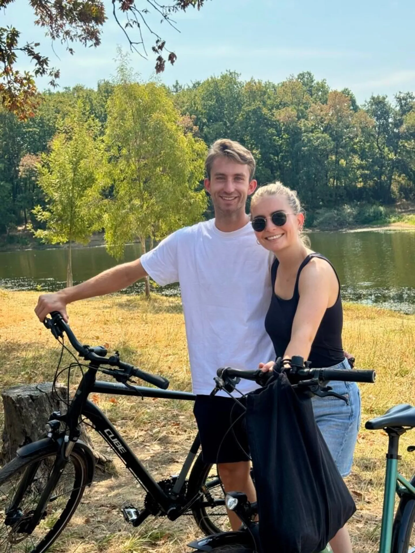 Riders with e-bikes by the lake in Grand Park, Tirana